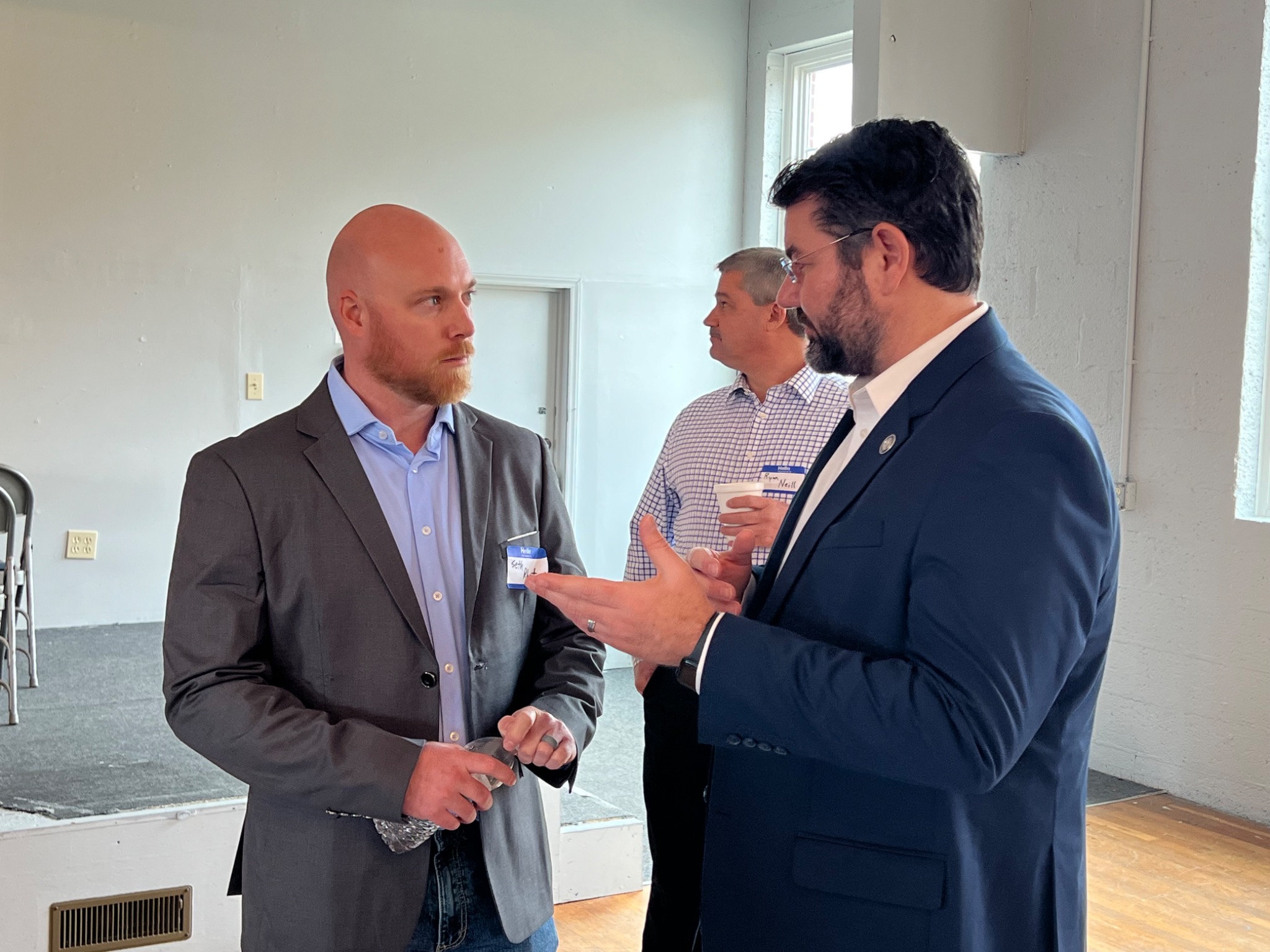 Bobby in conversation with attendees at a gathering.